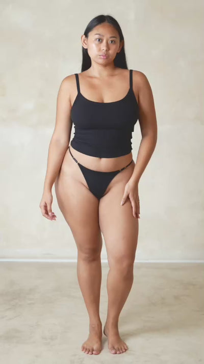 Studio K Rib One Shoulder Top in Black – sustainable, stylish, and comfortable yoga and lounge wear, available in multiple sizes.